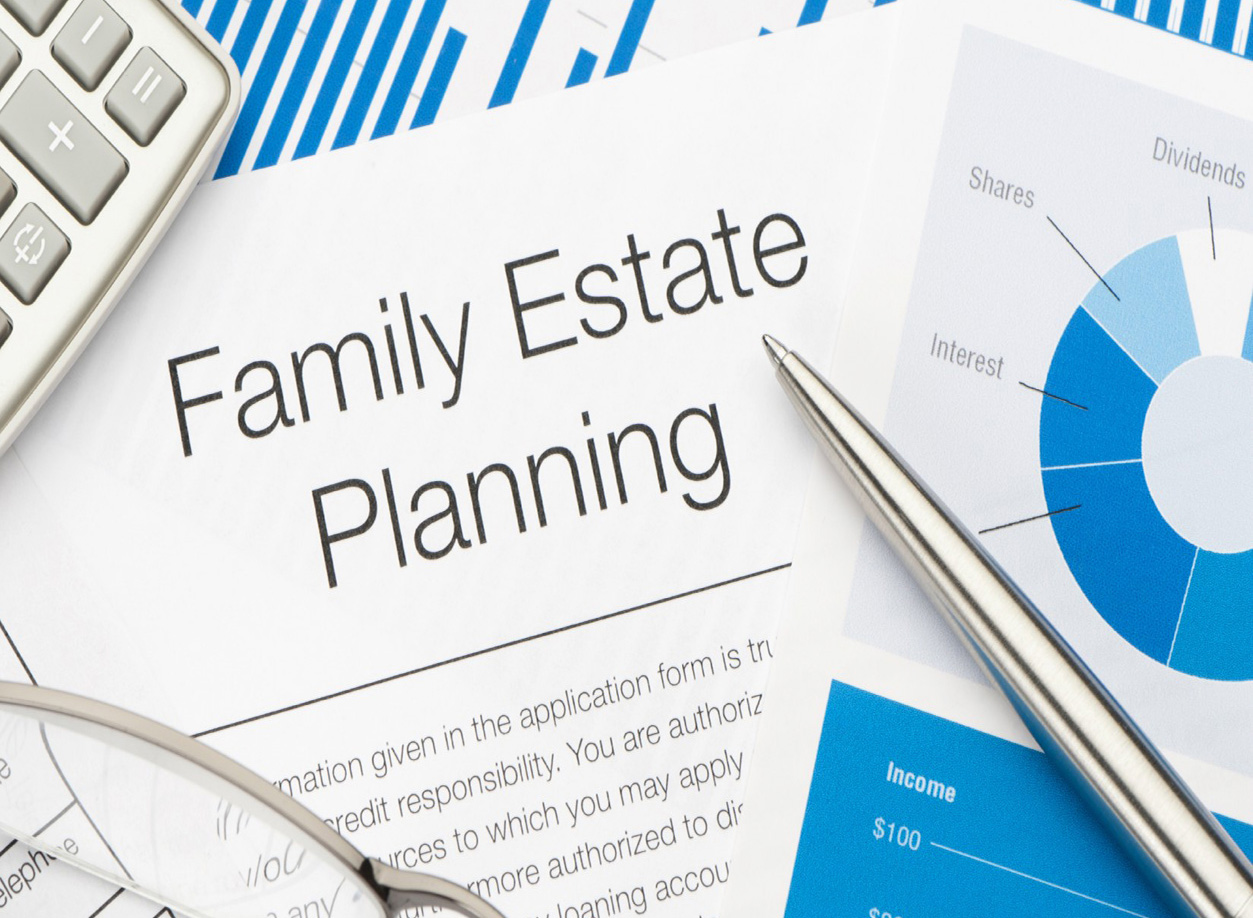 Attorneys reviewing estate planning and legal contracts in conference room